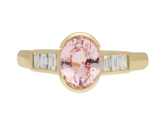 Pink Ceylon sapphire and diamond flanked solitaire ring, circa 1970. Hatton Garden