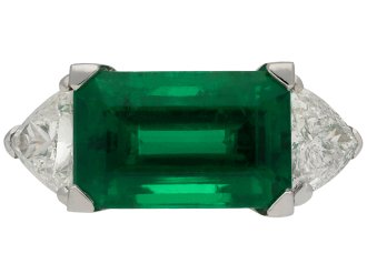 Colombian emerald diamond flanked solitaire ring hatton garden