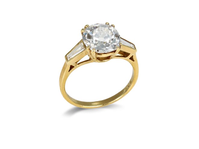 Old mine diamond flanked solitaire ring.