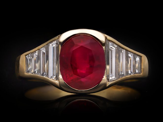 Burmese ruby and diamond flank solitaire ring, circa 1950. Hatton Garden