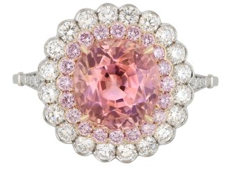 Padparadscha Ceylon sapphire and diamond cluster ring.
