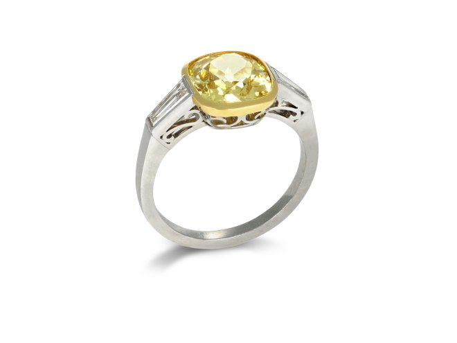 Fancy intense yellow diamond flanked solitaire ring, circa 1950.