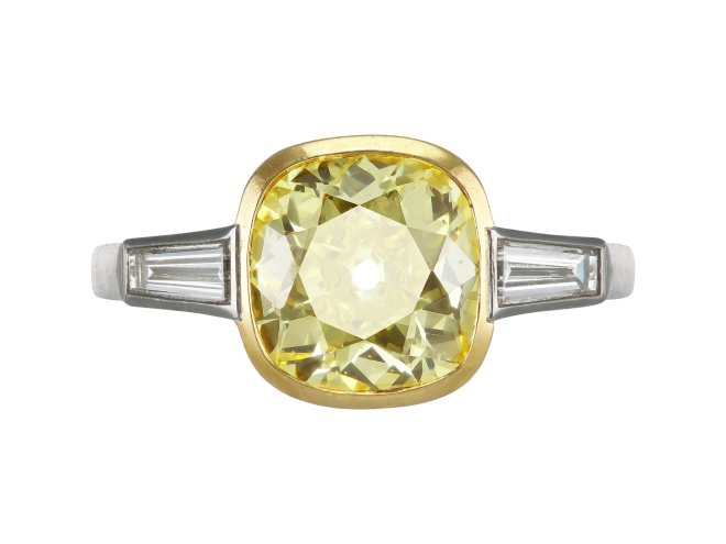 Fancy intense yellow diamond flanked solitaire ring, circa 1950.