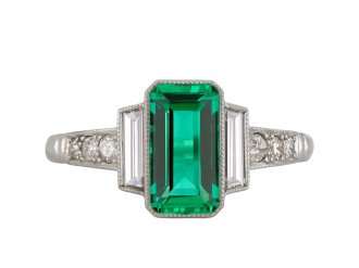 Colombian emerald diamond flanked solitaire ring hatton garden