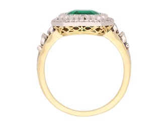 Colombian emerald and diamond cluster ring, circa 1905. Hatton Garden