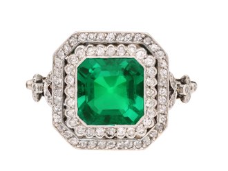 Colombian emerald and diamond cluster ring, circa 1905. Hatton Garden