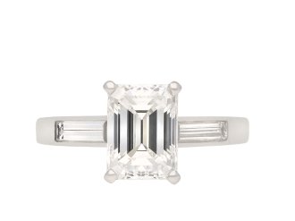 Tiffany & Co. diamond flanked solitaire ring. Hatton Garden