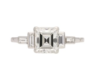 Art Deco diamond flanked solitaire ring, circa 1920. Hatton Garden