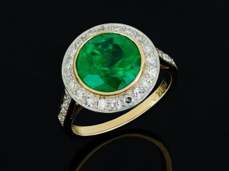 Colombian Emerald and diamond target ring hatton garden