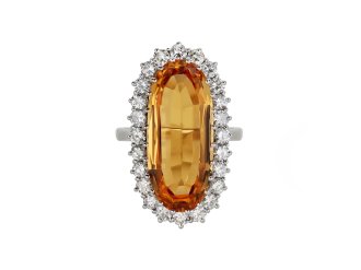 Imperial Topaz and diamond cluster ring, English, 1983. 