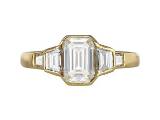 Vintage diamond flanked solitaire ring, circa 1970.
