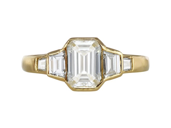 Vintage diamond flanked solitaire ring, circa 1970.