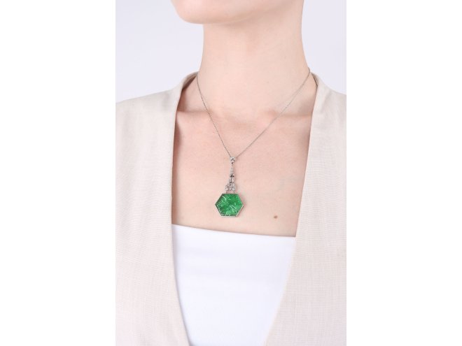 Carved emerald and diamond pendant, circa 1925. 