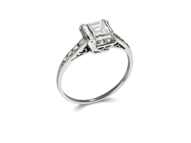 Asscher cut diamond flanked solitaire ring, circa 1930. 