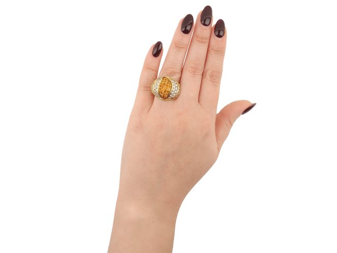 Kutchinsky yellow sapphire and diamond dress ring, circa 1980.