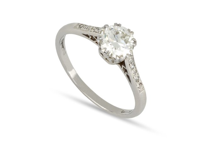 Old Cut diamond flanked solitaire, circa 1920.