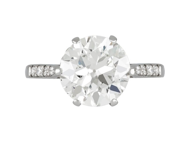 Old Cut diamond flanked solitaire ring, circa 1915.