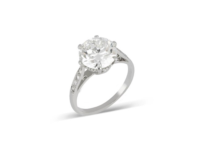 vOld Cut diamond flanked solitaire ring, circa 1915.