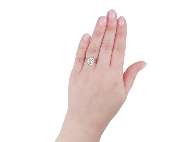 Old Cut diamond flanked solitaire ring, circa 1915.