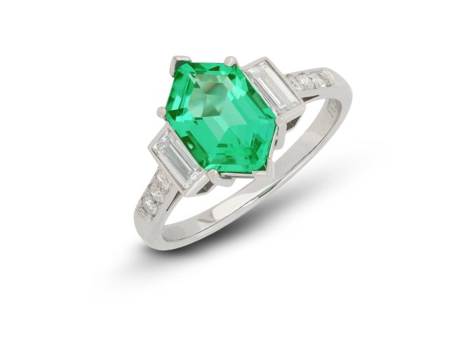 Emerald and diamond flanked solitaire ring, circa 1990