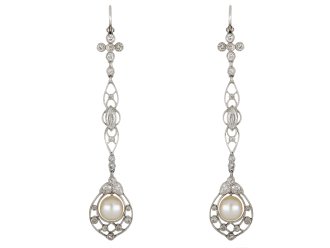Natural pearl and diamond drop earrings, circa 1915.