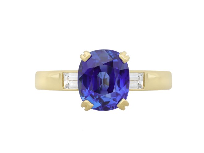 Burmese sapphire and diamond flanked solitaire ring.