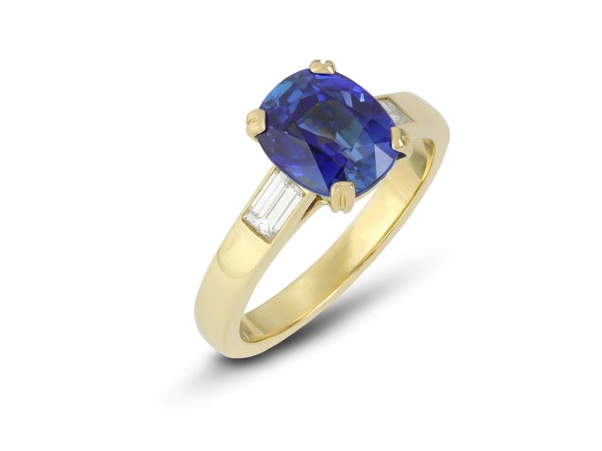 Burmese sapphire and diamond flanked solitaire ring.