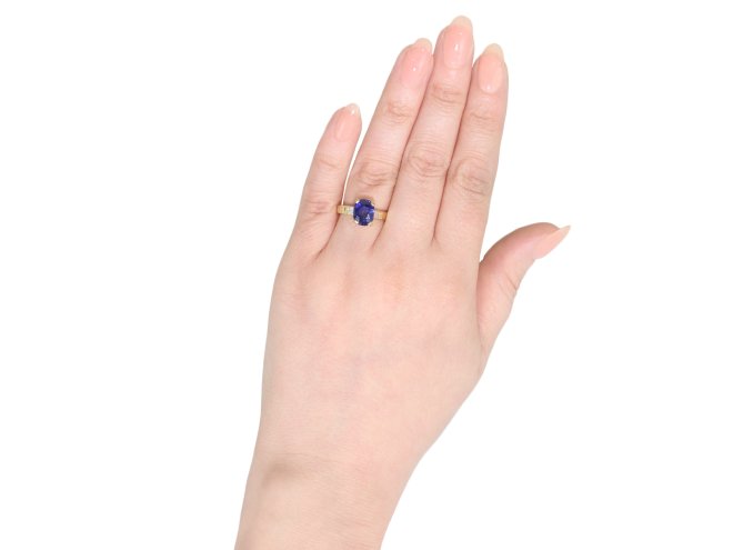 Burmese sapphire and diamond flanked solitaire ring.
