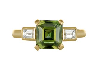 Green sapphire and diamond flanked solitaire ring, circa 1980. 