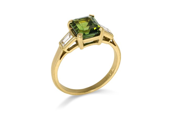 Green sapphire and diamond flanked solitaire ring, circa 1980. 