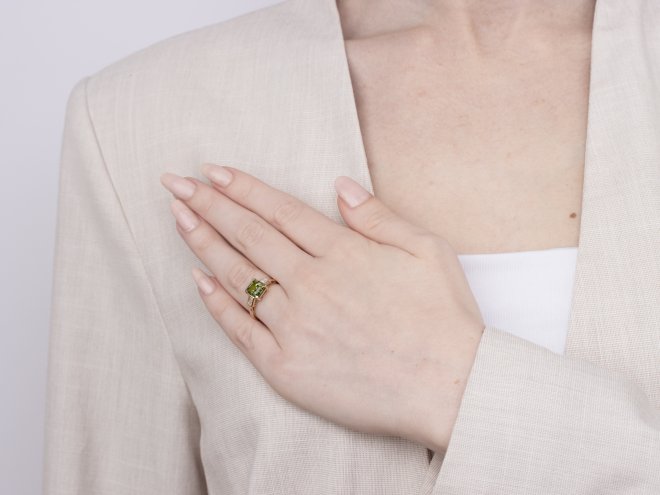 Green sapphire and diamond flanked solitaire ring, circa 1980. 