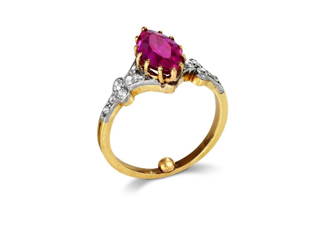 Burmese ruby and diamond flanked solitaire ring, circa 1915. 