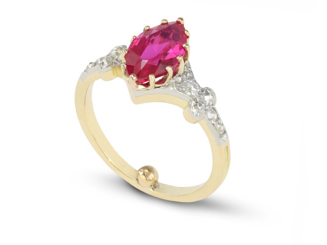 Burmese ruby and diamond flanked solitaire ring, circa 1915. 