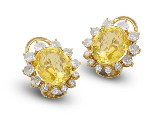 Yellow Ceylon sapphire and diamond cluster earrings, circa 1960.