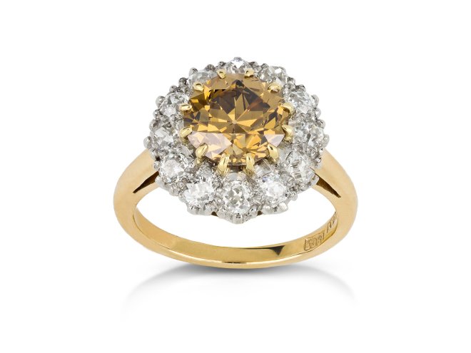 Fancy deep brown yellow diamond cluster ring, English, circa 1910. 