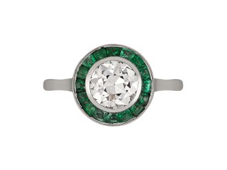 Diamond and emerald target ring, French, circa 1920. 