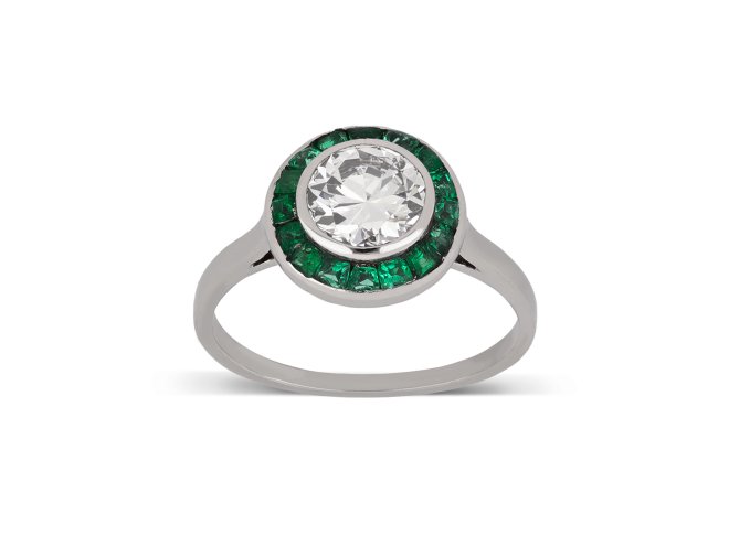 Diamond and emerald target ring, French, circa 1920. 
