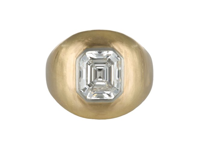 Emerald cut diamond gypsy ring, circa 1970.