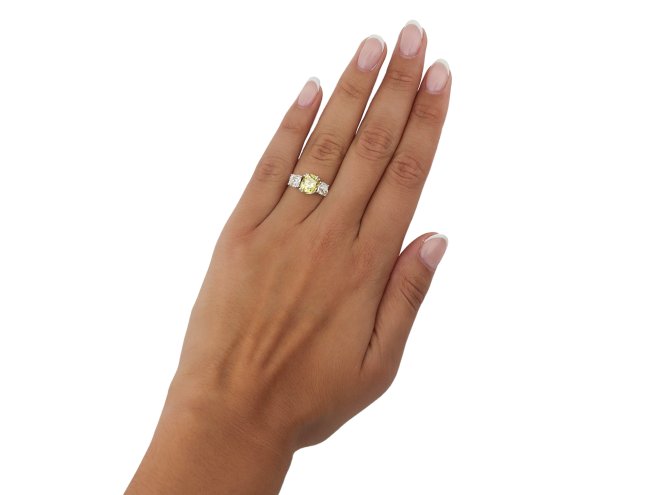 Fancy intense yellow diamond three stone ring, circa 1915