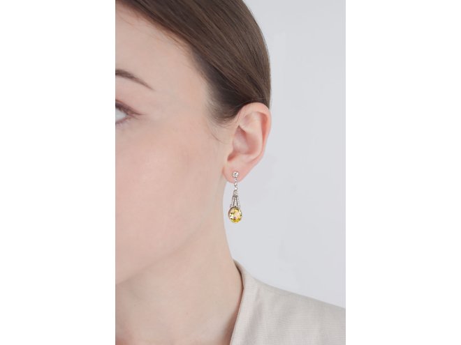 Yellow Ceylon sapphire and diamond drop earrings, circa 1920.