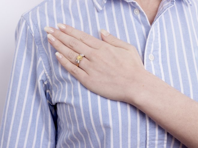 Fancy intense yellow diamond three stone ring, English, circa 1910.