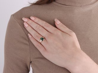 Teal sapphire and diamond flanked solitaire ring, circa 1970.