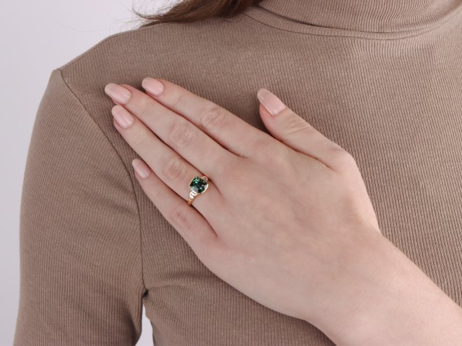 Teal sapphire and diamond flanked solitaire ring, circa 1970.