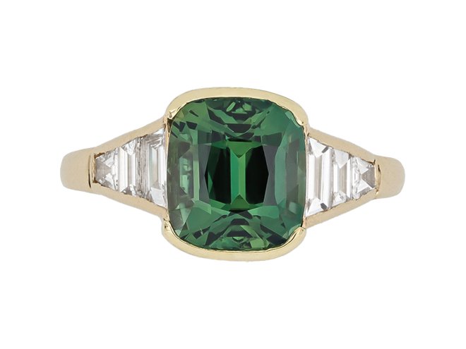 Teal sapphire and diamond flanked solitaire ring, circa 1970.