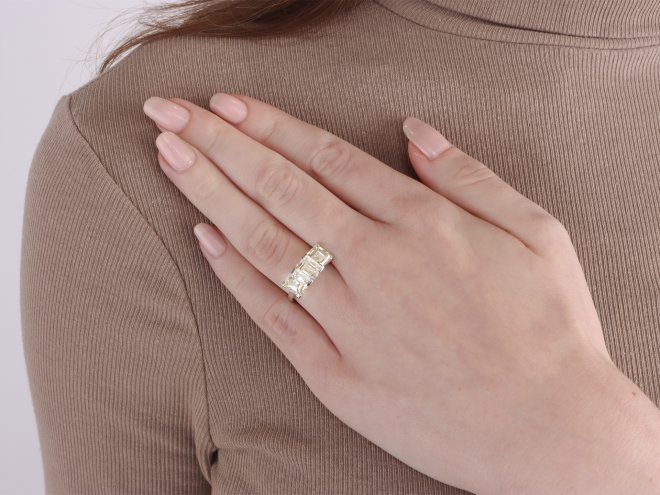 Step cut diamond three stone ring, circa 1950.