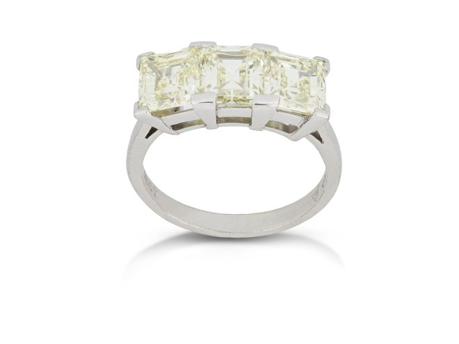 Step cut diamond three stone ring, circa 1950.