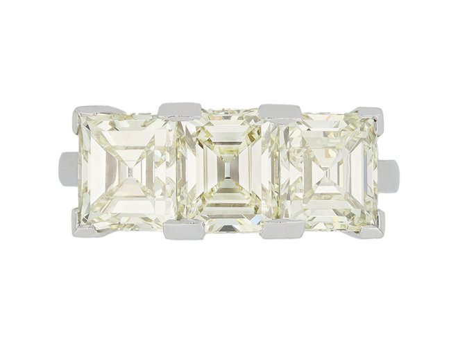 Step cut diamond three stone ring, circa 1950.