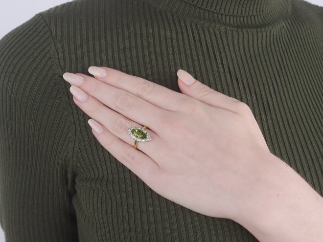 Peridot and diamond marquise cluster ring, circa 1900.