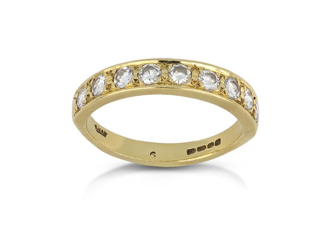 Diamond half eternity ring, English, 1974. 