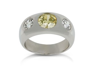 Fancy intense yellow diamond three stone gypsy ring, circa 1950.